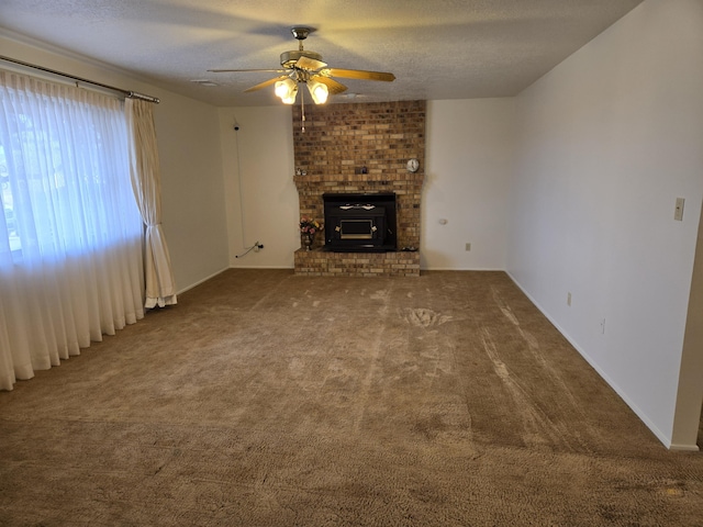 unfurnished living room featuring a textured ceiling, carpet, and ceiling fan