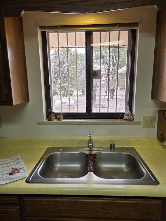room details featuring light countertops and a sink