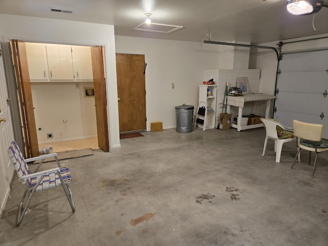 garage with visible vents and a garage door opener