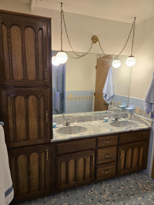full bath with double vanity and a sink