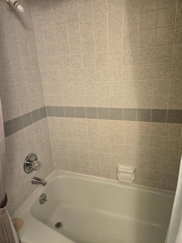 full bathroom with shower / bath combo