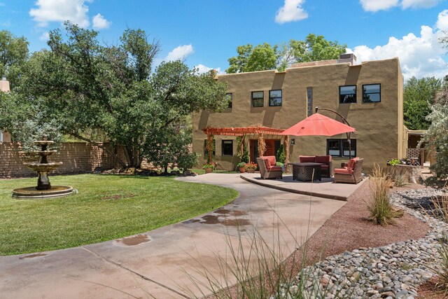 240 E Valverde Rd, Corrales, NM 87048 - view of front of home with a mountain view, stucco siding, and a patio area