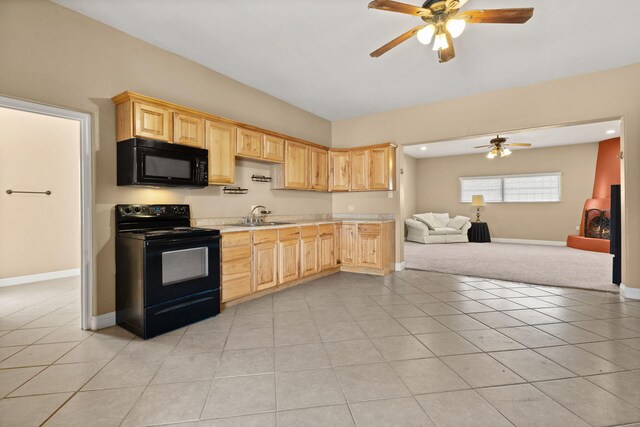 240 E Valverde Rd, Corrales, NM 87048 - sitting room featuring a wood stove, ceiling fan, recessed lighting, and carpet floors