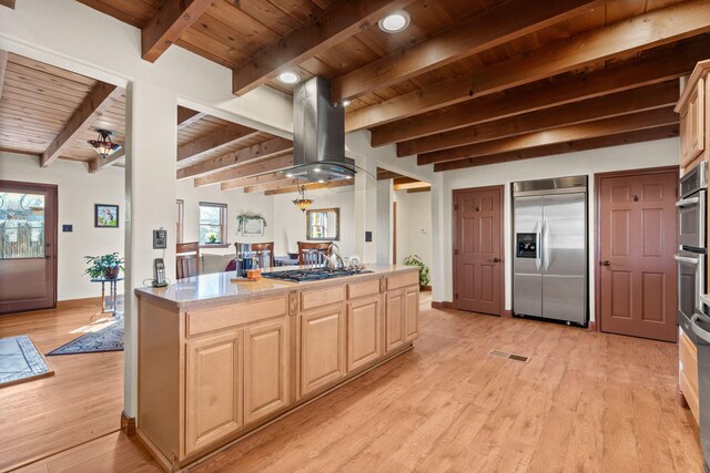 240 E Valverde Rd, Corrales, NM 87048 - dining room featuring a wooden ceiling with exposed beams, light wood-style flooring, and a large fireplace