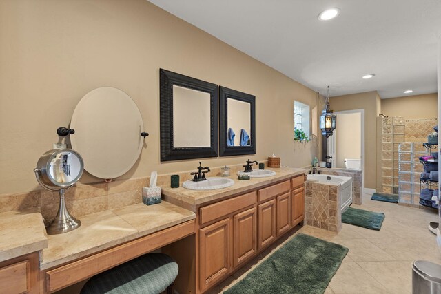 240 E Valverde Rd, Corrales, NM 87048 - bathroom featuring a tub with jets and tile patterned floors