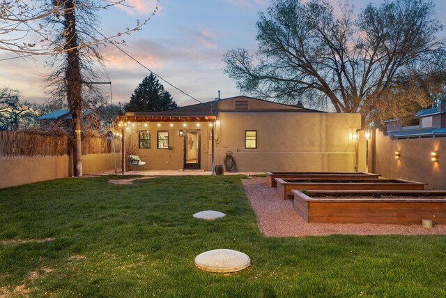 240 E Valverde Rd, Corrales, NM 87048 - property exterior at dusk with stucco siding