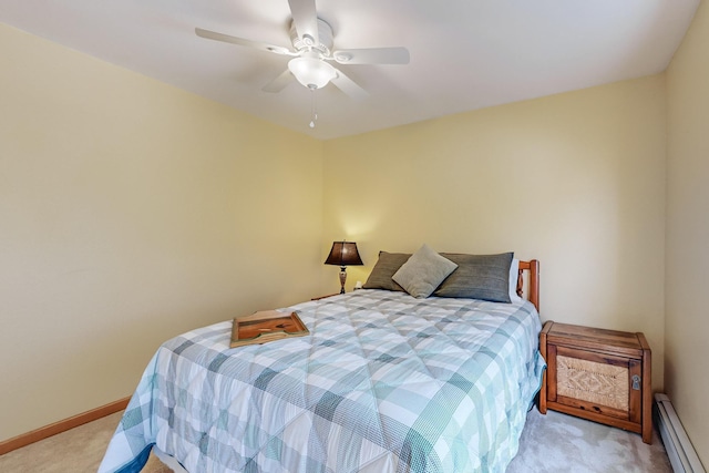 712 Navarra Way SE, Albuquerque, NM 87123 - bedroom with a baseboard radiator, light carpet, baseboards, and a ceiling fan