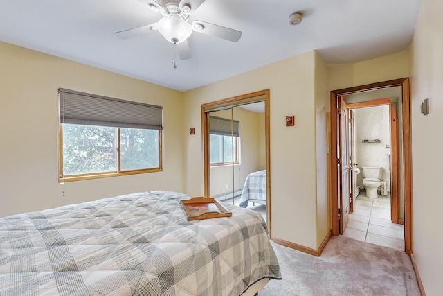 712 Navarra Way SE, Albuquerque, NM 87123 - bedroom featuring a baseboard heating unit, light colored carpet, a closet, and a ceiling fan
