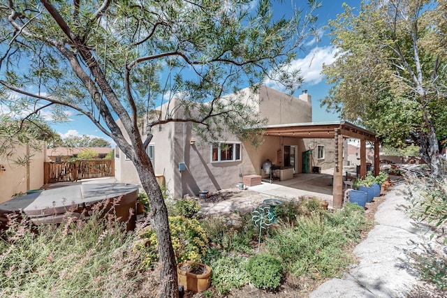 712 Navarra Way SE, Albuquerque, NM 87123 - rear view of house featuring stucco siding, a patio area, and a chimney
