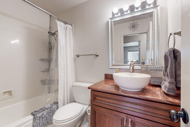 bathroom featuring toilet, a textured ceiling, shower / tub combo with curtain, and vanity