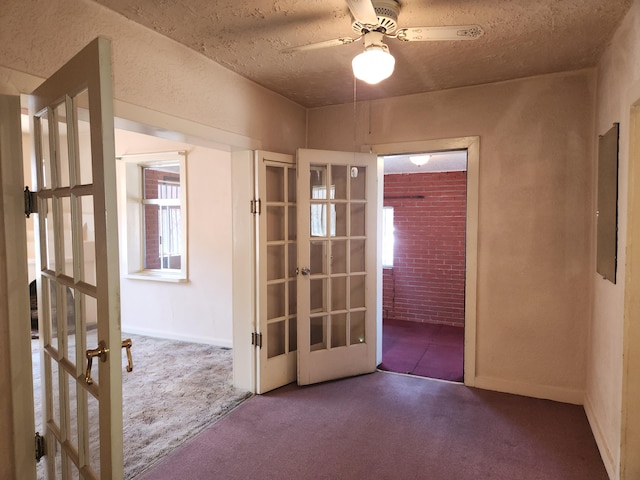 912 Camino Del Pueblo, Bernalillo, NM 87004 - spare room with french doors, a ceiling fan, and carpet floors