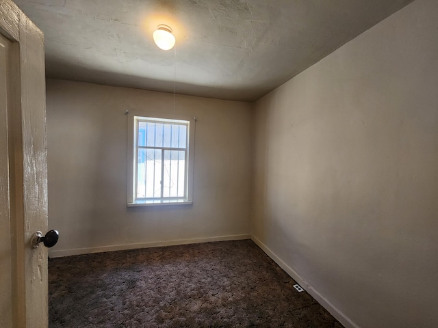 912 Camino Del Pueblo, Bernalillo, NM 87004 - spare room featuring baseboards and dark carpet