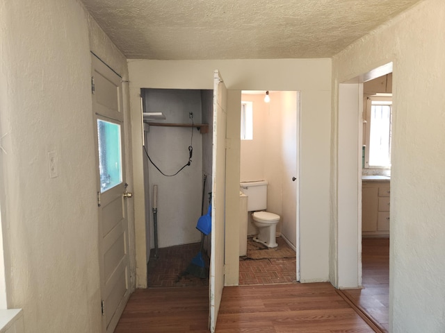 912 Camino Del Pueblo, Bernalillo, NM 87004 - bathroom with a textured ceiling, toilet, and wood finished floors