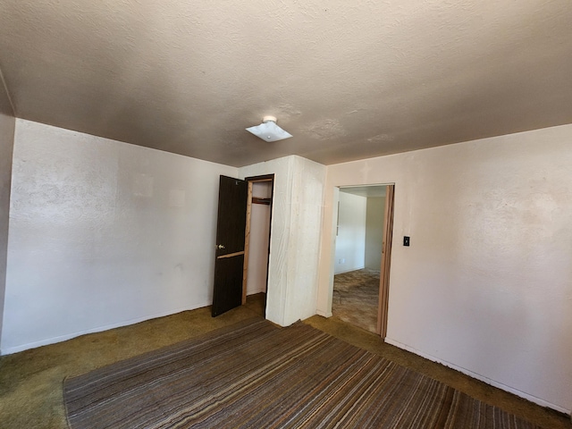 912 Camino Del Pueblo, Bernalillo, NM 87004 - empty room with carpet floors and a textured ceiling