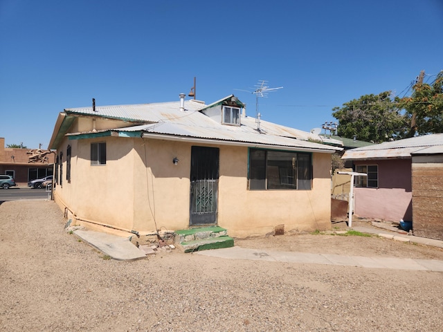 912 Camino Del Pueblo, Bernalillo, NM 87004 - bungalow-style house with stucco siding and metal roof
