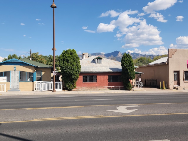 912 Camino Del Pueblo, Bernalillo, NM 87004 - view of front facade featuring a mountain view and fence
