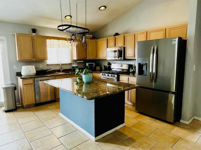 9405 Vervain Dr NW, Albuquerque, NM 87114 - kitchen with a kitchen island, appliances with stainless steel finishes, light tile patterned flooring, a sink, and lofted ceiling