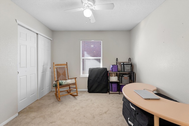 9405 Vervain Dr NW, Albuquerque, NM 87114 - home office with baseboards, light colored carpet, a textured ceiling, and ceiling fan