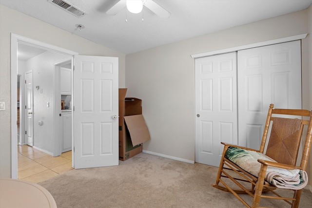 9405 Vervain Dr NW, Albuquerque, NM 87114 - living area with baseboards, vaulted ceiling, light carpet, a ceiling fan, and visible vents