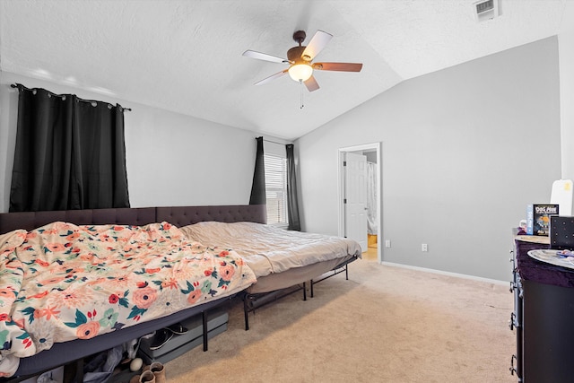 9405 Vervain Dr NW, Albuquerque, NM 87114 - bedroom featuring baseboards, vaulted ceiling, visible vents, ceiling fan, and light colored carpet