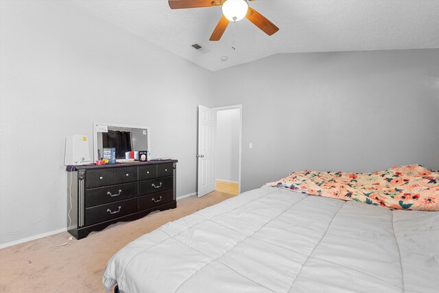 9405 Vervain Dr NW, Albuquerque, NM 87114 - bedroom featuring visible vents, baseboards, light carpet, and lofted ceiling