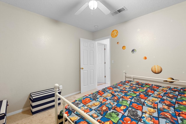 9405 Vervain Dr NW, Albuquerque, NM 87114 - bedroom featuring light carpet, ceiling fan, baseboards, and visible vents