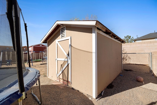 9405 Vervain Dr NW, Albuquerque, NM 87114 - view of shed featuring a fenced backyard and a playground