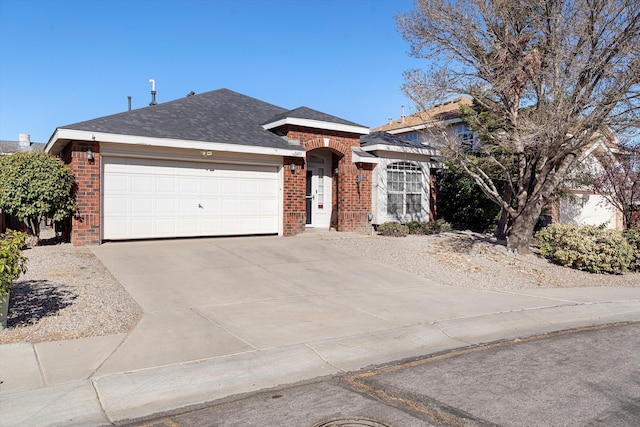 9405 Vervain Dr NW, Albuquerque, NM 87114 - ranch-style home featuring concrete driveway, brick siding, and a garage