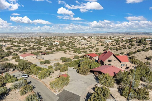 birds eye view of property with view of desert