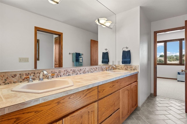 full bath with tasteful backsplash, double vanity, and a sink