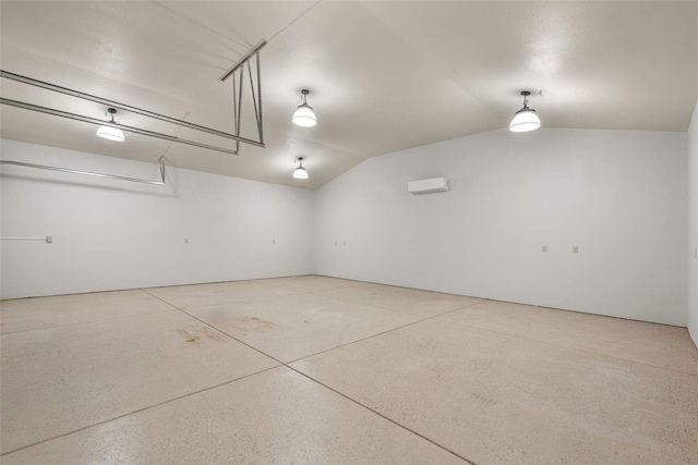 garage featuring a wall unit AC