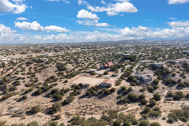 aerial view featuring a mountain view, a rural view, and view of desert