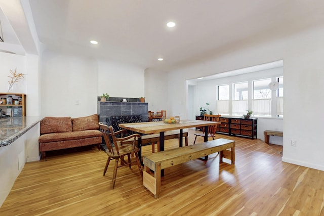 dining area with recessed lighting and light wood-style flooring