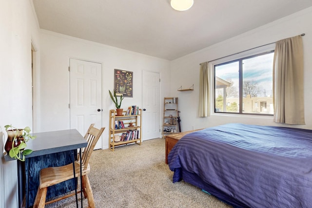 carpeted bedroom featuring ornamental molding
