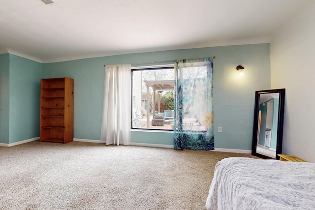 carpeted bedroom with baseboards