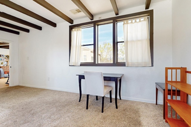 carpeted office with visible vents, baseboards, and beam ceiling