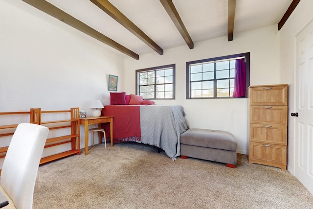 bedroom with beamed ceiling and carpet flooring