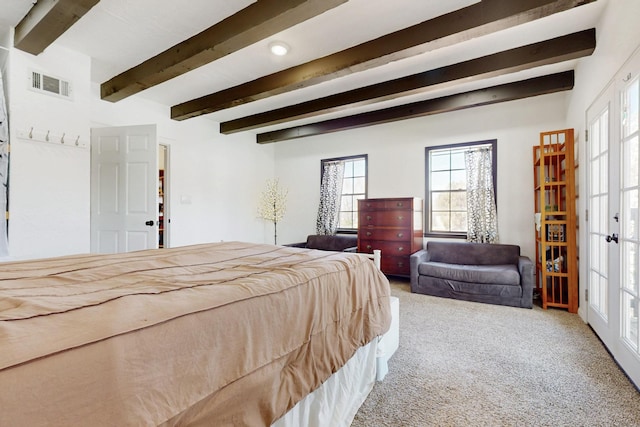 bedroom featuring french doors, visible vents, carpet floors, and beamed ceiling