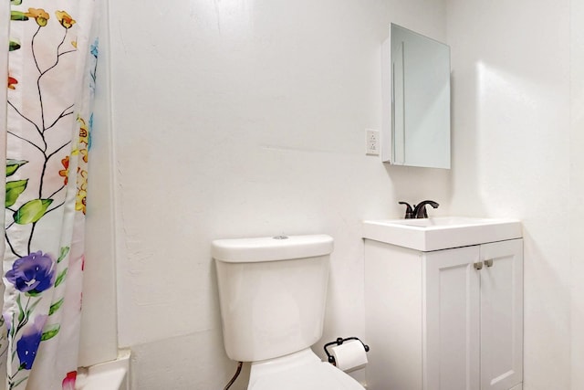 full bath featuring toilet and vanity
