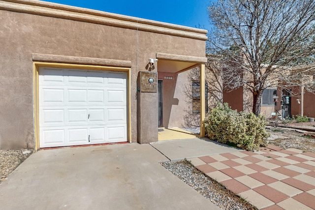 6817 Armand Rd NW, Albuquerque, NM 87120 - garage with concrete driveway