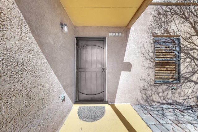 6817 Armand Rd NW, Albuquerque, NM 87120 - property entrance featuring stucco siding