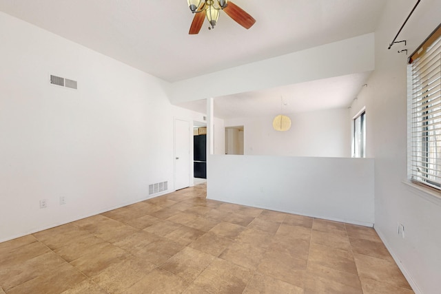 6817 Armand Rd NW, Albuquerque, NM 87120 - unfurnished room with visible vents, baseboards, and a ceiling fan