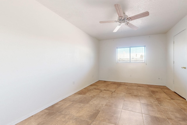 6817 Armand Rd NW, Albuquerque, NM 87120 - empty room with light tile patterned floors, a textured ceiling, and ceiling fan
