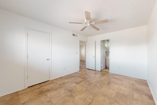 6817 Armand Rd NW, Albuquerque, NM 87120 - unfurnished bedroom with visible vents, ceiling fan, ensuite bathroom, and baseboards