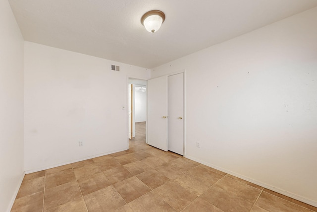 6817 Armand Rd NW, Albuquerque, NM 87120 - empty room with baseboards and visible vents
