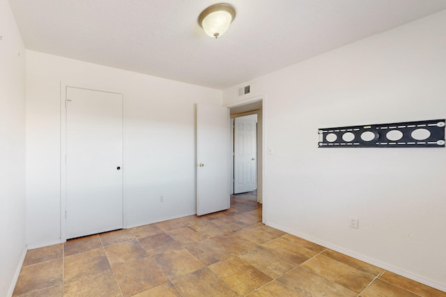 6817 Armand Rd NW, Albuquerque, NM 87120 - empty room featuring baseboards and visible vents