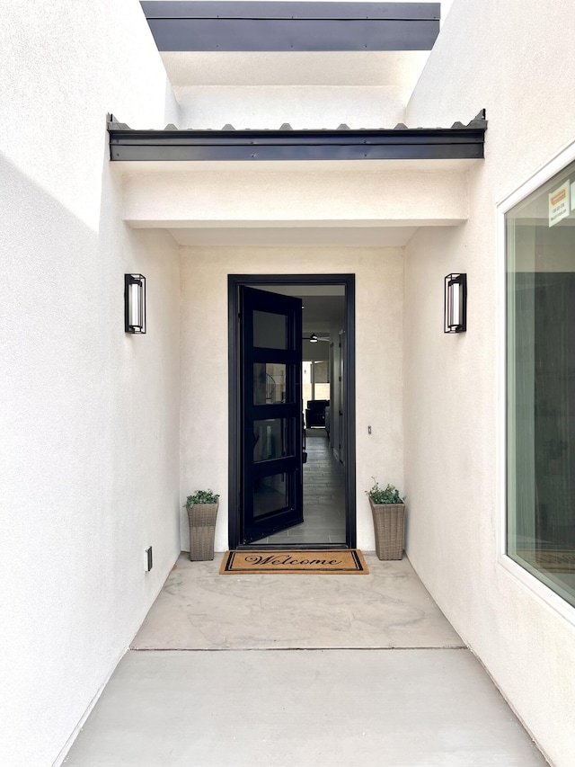 7908 Emerald Dr NW, Albuquerque, NM 87120 - doorway to property with stucco siding