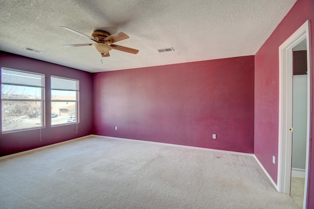 5750 Quay St, Rio Rancho, NM 87144 - carpeted empty room featuring visible vents, a ceiling fan, baseboards, and a textured ceiling