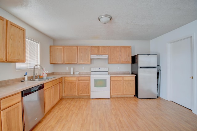 5750 Quay St, Rio Rancho, NM 87144 - kitchen featuring under cabinet range hood, appliances with stainless steel finishes, light brown cabinets, and a sink