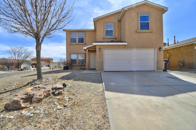 5750 Quay St, Rio Rancho, NM 87144 - traditional-style home with stucco siding, a garage, and concrete driveway